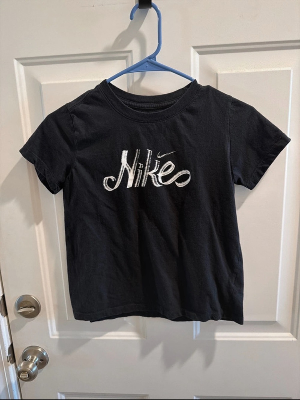 Nike Black Short Sleeve Kids Logo Tee with White Embroidered Script